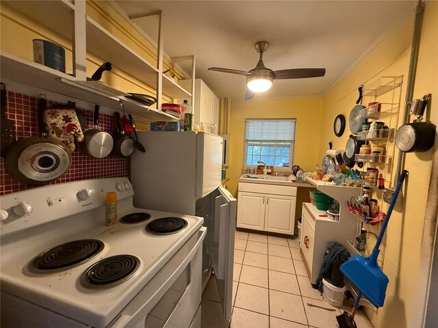 2424 Bates Ave SW, Winter Haven, FL 33880 - kitchen with white range with electric stovetop, white cabinetry, a ceiling fan, open shelves, and light tile patterned floors