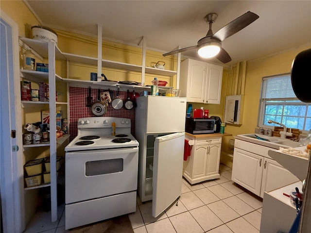 2424 Bates Ave SW, Winter Haven, FL 33880 - kitchen featuring white appliances, a sink, light tile patterned flooring, white cabinetry, and open shelves