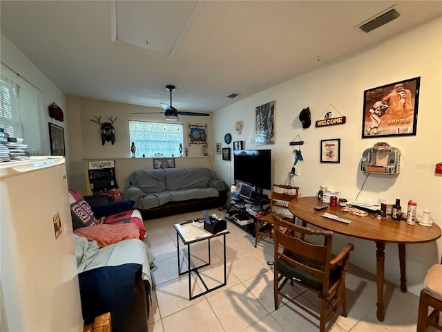 2424 Bates Ave SW, Winter Haven, FL 33880 - living room with light tile patterned floors, attic access, and a ceiling fan