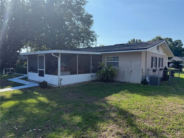 2424 Bates Ave SW, Winter Haven, FL 33880 - back of house with a sunroom and central AC unit