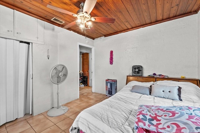 320 W Carver St, Lakeland, FL 33805 - bedroom with wooden ceiling, light tile patterned floors, ceiling fan, a closet, and ornamental molding