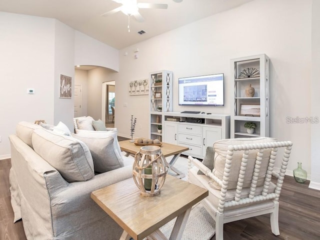877 Cypress Creek Run, Saint Cloud, FL 34771 - living area featuring ceiling fan, wood finished floors, baseboards, lofted ceiling, and arched walkways