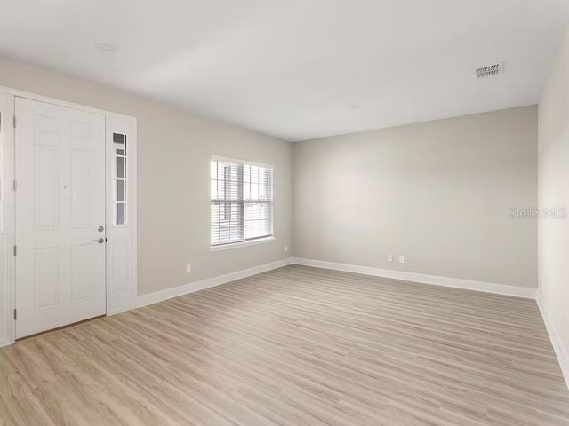 828 Cypress Creek Run, Saint Cloud, FL 34771 - foyer entrance with light wood-style floors and baseboards