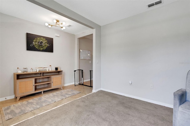3685 Diving Dove Ln, Bartow, FL 33830 - carpeted living area featuring a chandelier and baseboards