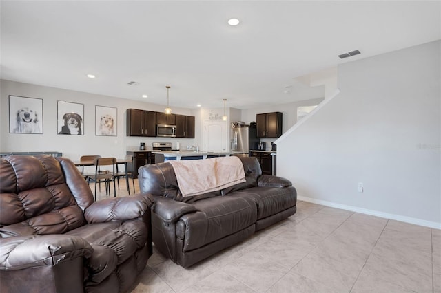 3685 Diving Dove Ln, Bartow, FL 33830 - living room featuring recessed lighting and light tile patterned floors