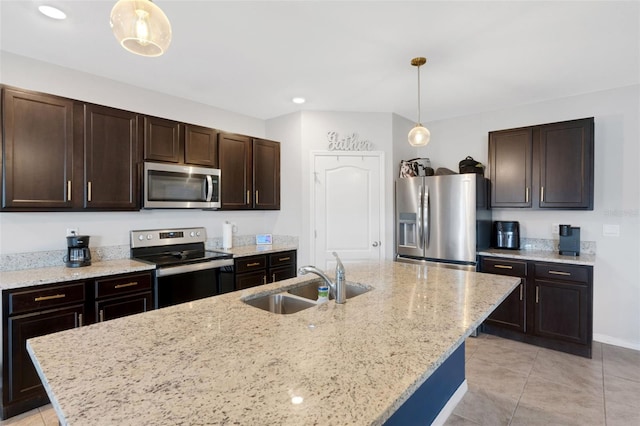 3685 Diving Dove Ln, Bartow, FL 33830 - kitchen with appliances with stainless steel finishes, light tile patterned flooring, dark brown cabinetry, decorative light fixtures, and recessed lighting