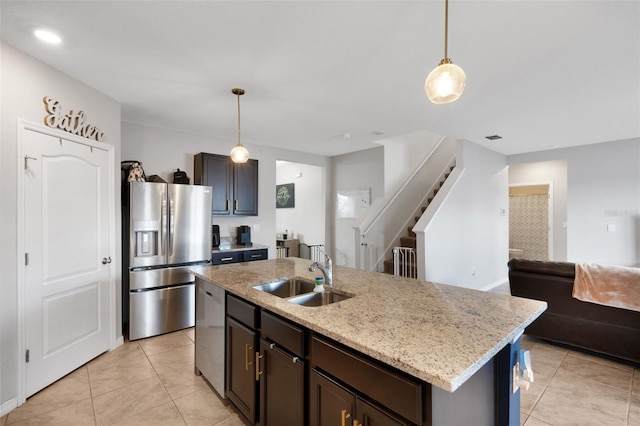3685 Diving Dove Ln, Bartow, FL 33830 - kitchen featuring stainless steel appliances, light tile patterned floors, pendant lighting, and light stone counters