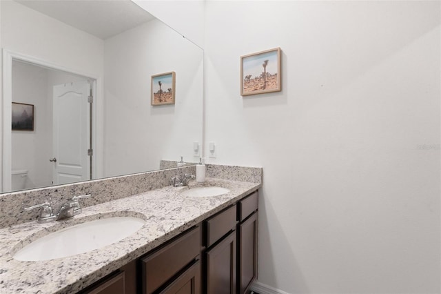 3685 Diving Dove Ln, Bartow, FL 33830 - bathroom featuring double vanity and toilet