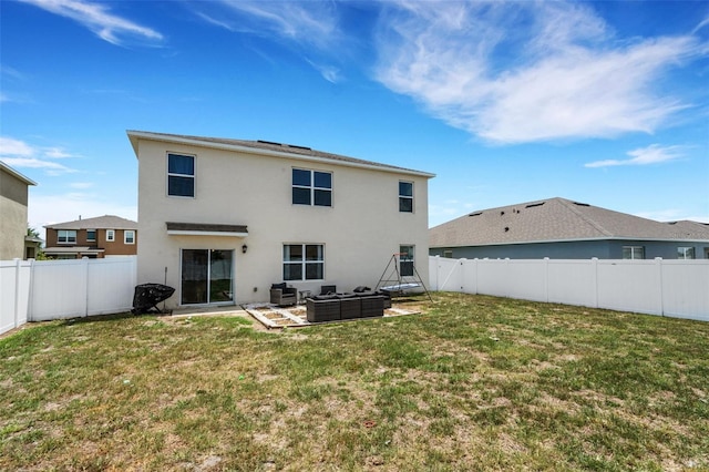 3685 Diving Dove Ln, Bartow, FL 33830 - rear view of house with an outdoor hangout area, stucco siding, a fenced backyard, and a patio
