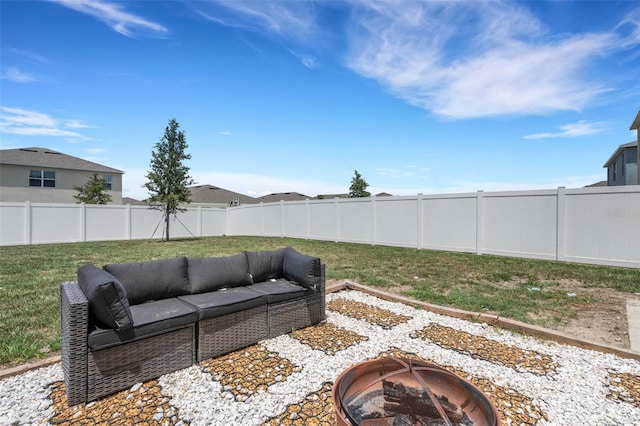 3685 Diving Dove Ln, Bartow, FL 33830 - fenced backyard with an outdoor living space with a fire pit