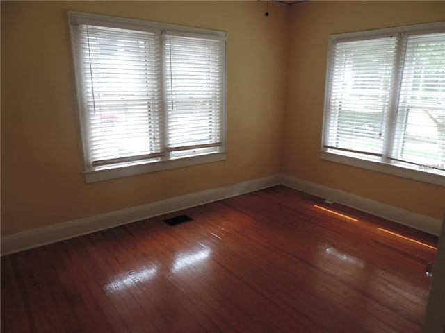 701 E Lime St, Lakeland, FL 33801 - unfurnished room with baseboards and wood finished floors