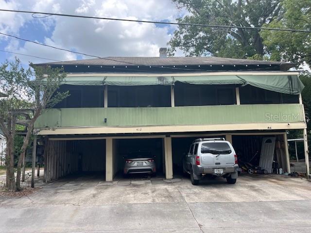 701 E Lime St, Lakeland, FL 33801 - view of front of property featuring an attached garage and driveway