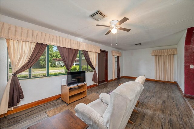 114 Pennsylvania Ave, Wauchula, FL 33873 - living room featuring ceiling fan and dark wood-style flooring