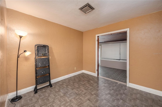 114 Pennsylvania Ave, Wauchula, FL 33873 - unfurnished bedroom with baseboards and a textured wall