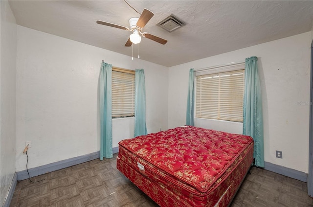 114 Pennsylvania Ave, Wauchula, FL 33873 - bedroom with baseboards and a ceiling fan