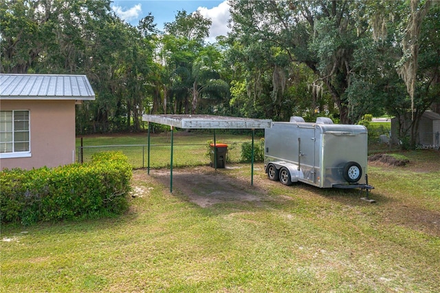 114 Pennsylvania Ave, Wauchula, FL 33873 - view of green lawn featuring a carport