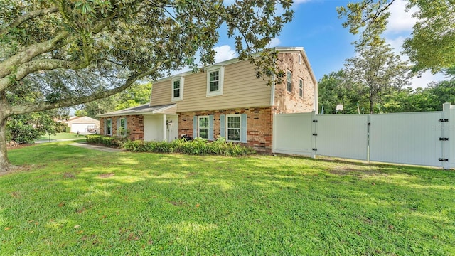 1910 Clubhouse Rd, Lakeland, FL 33813 - view of front of house with brick siding and a gate