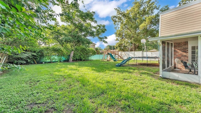 1910 Clubhouse Rd, Lakeland, FL 33813 - view of yard with a playground and a trampoline