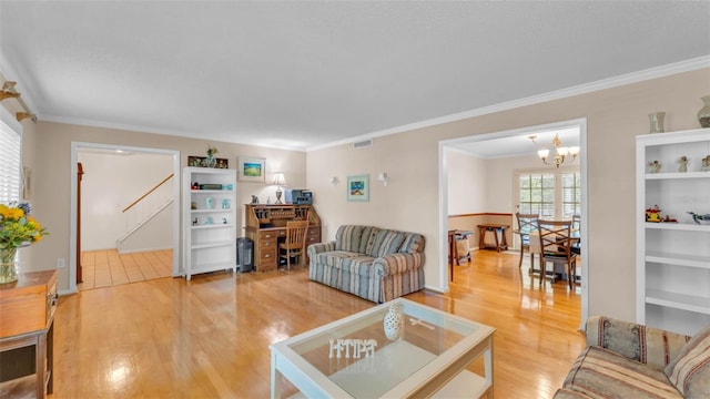 1910 Clubhouse Rd, Lakeland, FL 33813 - living room featuring light wood finished floors, ornamental molding, and a chandelier