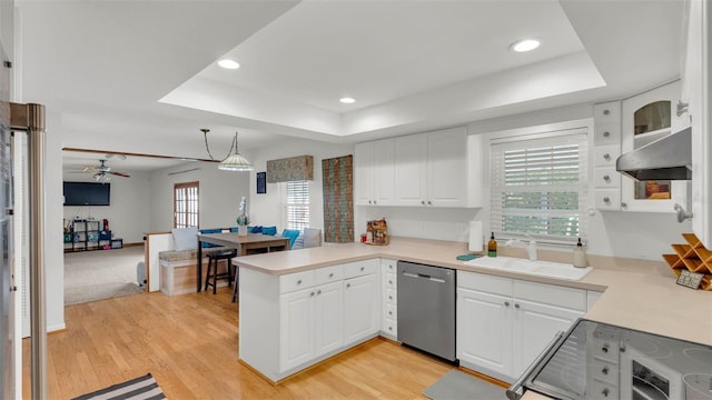 1910 Clubhouse Rd, Lakeland, FL 33813 - kitchen featuring dishwasher, a raised ceiling, a peninsula, a sink, and recessed lighting