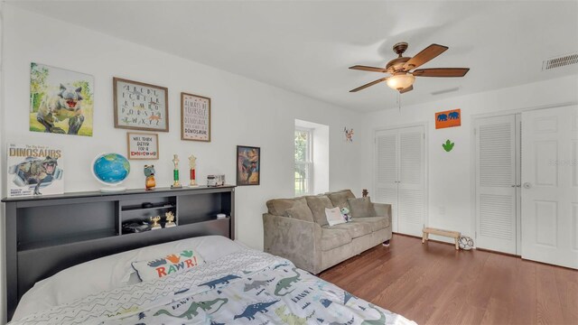 1910 Clubhouse Rd, Lakeland, FL 33813 - bedroom with wood finished floors, multiple closets, and ceiling fan