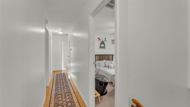 1910 Clubhouse Rd, Lakeland, FL 33813 - corridor with light wood finished floors and baseboards