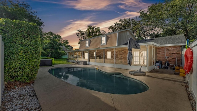 1910 Clubhouse Rd, Lakeland, FL 33813 - back of house with a patio, brick siding, an outdoor pool, and french doors