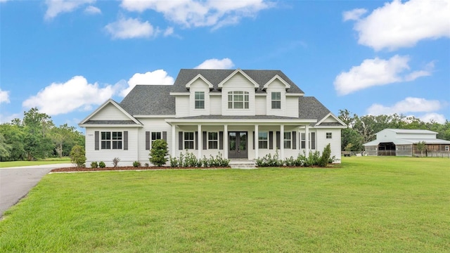 1385 Ewell Rd, Lakeland, FL 33811 - view of front of home featuring a shingled roof and covered porch