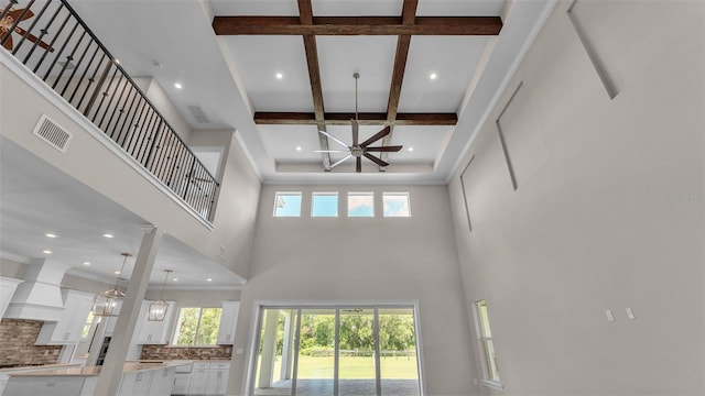 1385 Ewell Rd, Lakeland, FL 33811 - unfurnished living room featuring a towering ceiling, coffered ceiling, beamed ceiling, and recessed lighting