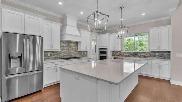 1385 Ewell Rd, Lakeland, FL 33811 - kitchen featuring stainless steel appliances, custom exhaust hood, light countertops, white cabinets, and recessed lighting