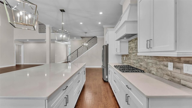 1385 Ewell Rd, Lakeland, FL 33811 - kitchen featuring premium range hood, a chandelier, stainless steel appliances, recessed lighting, and white cabinetry