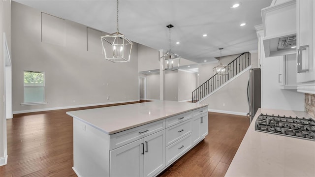 1385 Ewell Rd, Lakeland, FL 33811 - kitchen with light countertops, recessed lighting, white cabinets, open floor plan, and dark wood-style floors