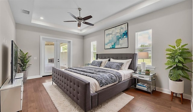 1385 Ewell Rd, Lakeland, FL 33811 - bedroom featuring french doors, access to exterior, a raised ceiling, multiple windows, and recessed lighting