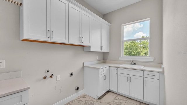 1385 Ewell Rd, Lakeland, FL 33811 - laundry room with cabinet space, light marble finish floors, hookup for an electric dryer, and hookup for a gas dryer