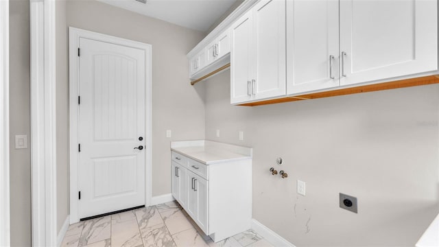 1385 Ewell Rd, Lakeland, FL 33811 - washroom with light marble finish flooring, electric dryer hookup, and cabinet space