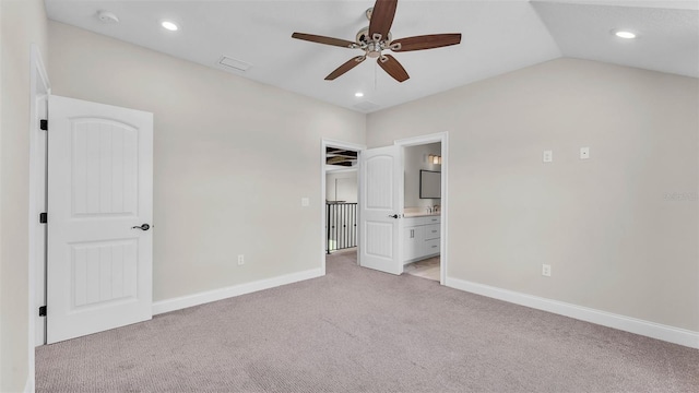 1385 Ewell Rd, Lakeland, FL 33811 - unfurnished bedroom with light colored carpet, ensuite bath, recessed lighting, a ceiling fan, and lofted ceiling