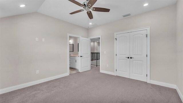 1385 Ewell Rd, Lakeland, FL 33811 - unfurnished bedroom with light colored carpet, recessed lighting, a closet, ensuite bath, and a ceiling fan
