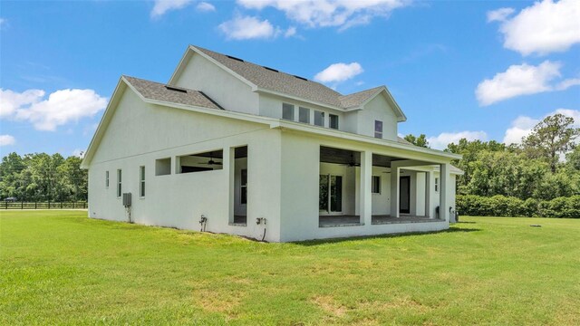 1385 Ewell Rd, Lakeland, FL 33811 - back of property featuring a ceiling fan and stucco siding