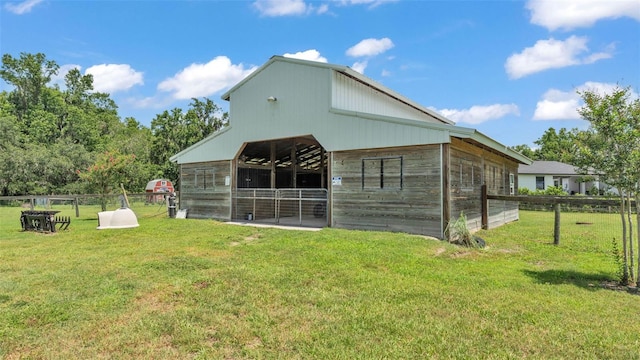 1385 Ewell Rd, Lakeland, FL 33811 - back of house featuring an outdoor structure and an exterior structure