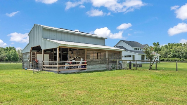 1385 Ewell Rd, Lakeland, FL 33811 - rear view of house featuring an exterior structure and an outbuilding