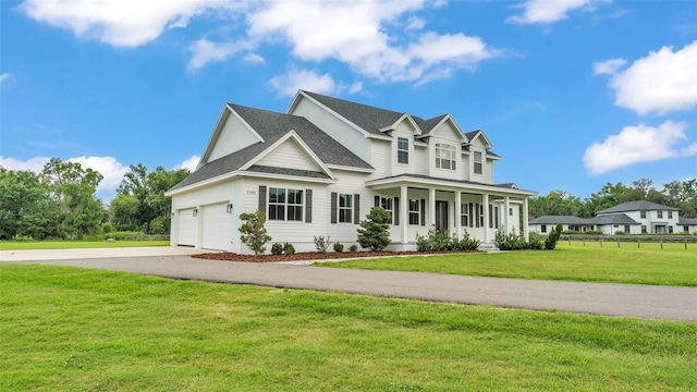 1385 Ewell Rd, Lakeland, FL 33811 - view of front of property with driveway, covered porch, and a shingled roof