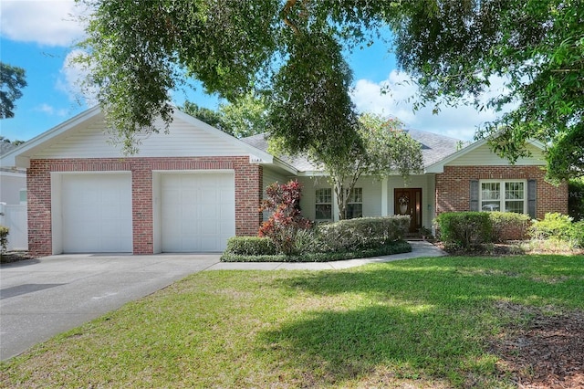 1145 Denton St, Lakeland, FL 33803 - ranch-style home featuring brick siding, an attached garage, a front lawn, and driveway
