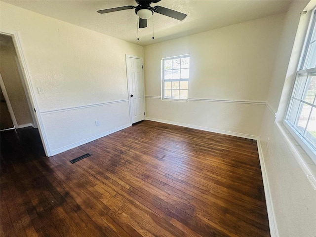938 E Lowell St, Lakeland, FL 33805 - empty room featuring wood-type flooring, a ceiling fan, and plenty of natural light