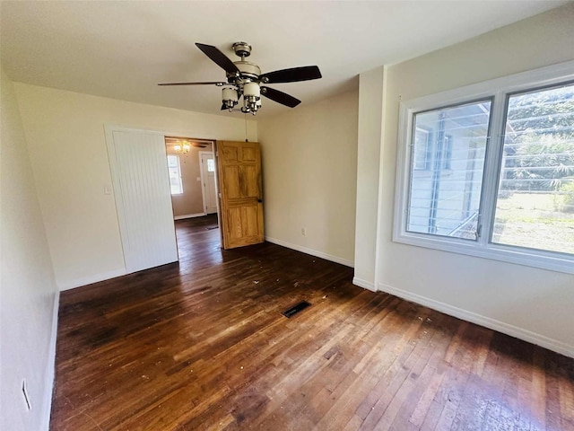 938 E Lowell St, Lakeland, FL 33805 - unfurnished room featuring a ceiling fan, dark wood-style flooring, and baseboards