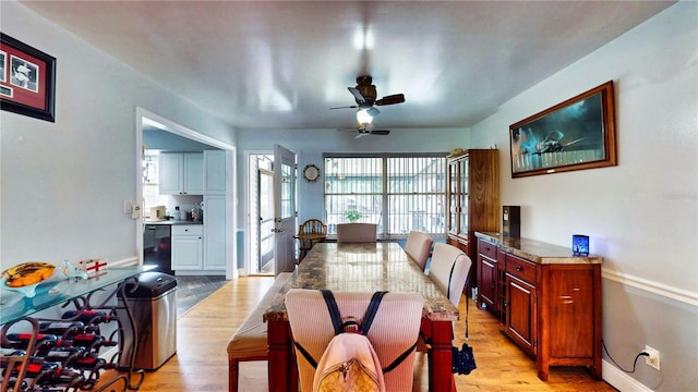 2333 Cheshire Pl, Lakeland, FL 33810 - dining area with light wood-type flooring, ceiling fan, and baseboards