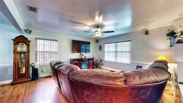 2333 Cheshire Pl, Lakeland, FL 33810 - living area featuring plenty of natural light, a ceiling fan, and light wood-style flooring