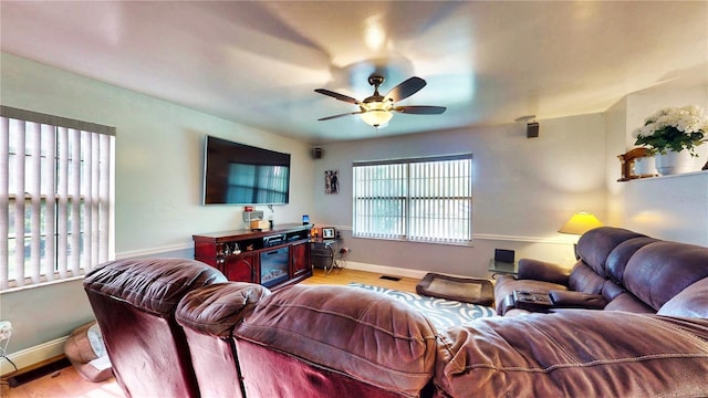 2333 Cheshire Pl, Lakeland, FL 33810 - living area featuring a ceiling fan, light wood-type flooring, and baseboards