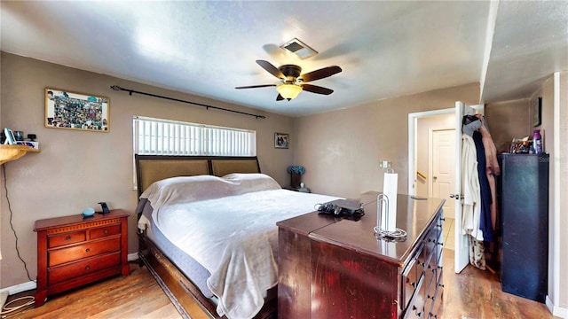 2333 Cheshire Pl, Lakeland, FL 33810 - bedroom with wood finished floors and ceiling fan