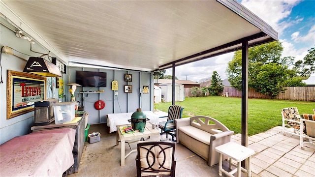 2333 Cheshire Pl, Lakeland, FL 33810 - fenced backyard with a storage unit, a patio area, and an outdoor hangout area