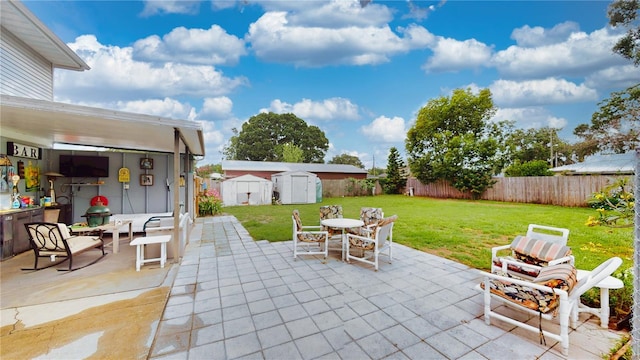 2333 Cheshire Pl, Lakeland, FL 33810 - fenced backyard with a shed, a patio, and outdoor dining area